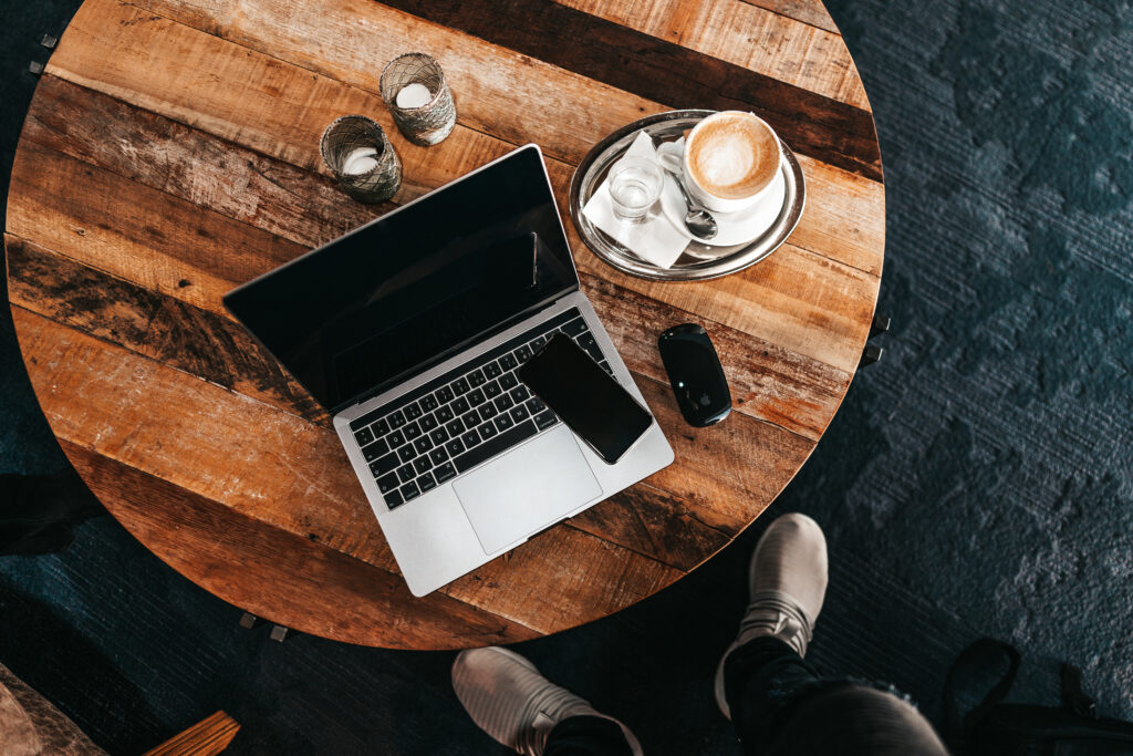 laptop-on-a-round-wooden-table-flat-lay-picjumbo-com